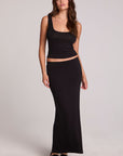 Full body front view of a woman wearing the Chaser Eloyse Black Maxi Skirt and matching black top on a neutral background