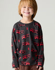 Front view of a boy wearing the Chaser Fire Trucks Boys Tee on a neutral background with arms lowered at sides