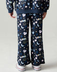 Back view of a girl wearing the Chaser Free Draw Pants Girls Jogger on a neutral background