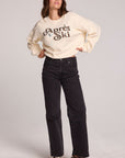 A full body front view of a woman wearing the Chaser How's Your Ap Res Sweatshirt on a neutral background