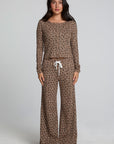 Full body front view of a woman wearing the Chaser Jorgia Leopard Pant on a neutral background with matching top