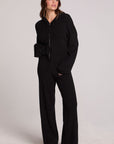 A full body front view of a woman wearing the Chaser Lizbeth Black Hoodie Jacket on a neutral background