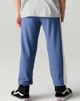 Back view of a boy wearing the Chaser Lounge Pants Boys Shamu Jogger on a neutral background