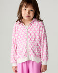 Front view of a girl wearing the Chaser Love Is Everywhere Girls Hoodie and pink pants