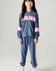 Full body front view of a girl wearing the Chaser Multi Stripes Girls Hoodie on a neutral background with pants