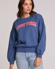Front view of a woman wearing the Chaser New York Tee on a neutral background