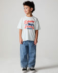 Full body view of a boy wearing the Chaser Speedway Tee on a neutral background