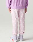 Back view of a girl wearing the Chaser Stars Allover Girls Jogger on a neutral background
