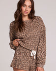 Front view of a woman wearing the Chaser Suzzans Leopard Sweatshirt on a neutral background