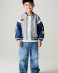 A full body front view of a boy wearing the Chaser Team Spirit Boys Jacket on a neutral background