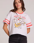 Front view of a woman wearing the cropped Chaser Teddy Tee on a neutral background and black pants
