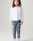 A full body front view of a girl wearing the Chaser Under The Stars Girls Tee on a neutral background