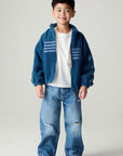 A full body front view of a boy wearing the Chaser White Bolts Boys Jacket on a neutral background