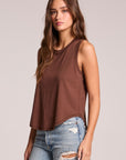 Side angle view of a woman wearing the Chaser Flouncy Kahlua Muscle Tank on a neutral background with arms at her sides