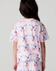 Back view of a girl wearing the Chaser Flutter Butterfly Tee on a neutral background