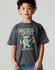 Front view of a boy wearing the Chaser Grateful Dead Tour Tee on a neutral background
