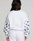 Back view of a woman wearing the Chaser High Spirits Long Sleeve on a neutral background