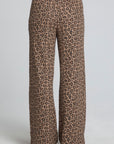 Back view of a woman wearing the Chaser Jorgia Leopard Pant on a neutral background