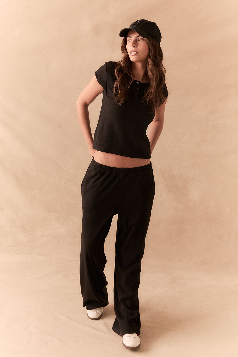 True black fleece joggers with side pockets and relaxed silhouette.