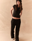 True black fleece joggers with side pockets and relaxed silhouette.
