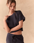 Front view of model in Irvine Tee in midnight blue with soft thermal texture and matching Billy Joggers against a beige background