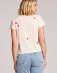 Back view of a woman wearing the Chaser Lips Embroidery Tee on a neutral background