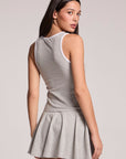 A back view of a woman wearing the Chaser Heather Grey Lisbon Tank on a neutral background, looking over her shoulder