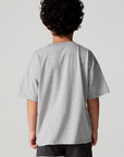 Back view of a boy wearing the Chaser Moto LA Tee on a neutral background