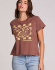 Front view of a woman wearing the Chaser Off Road Race Team Graphic Tee on a neutral background