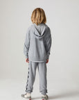 Full body back view of a boy wearing the Chaser Paxton Heather Grey Zip Up Hoodie on a neutral background