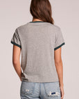Back view of a woman wearing the Chaser Rambler Streaky Grey and Pine Tee on a neutral background