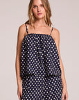 Front view of a woman wearing the Chaser Rubie Navy Spot Tank Top and matching pants on a neutral background
