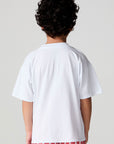Back view of a boy wearing the Chaser Sunglass Pop Tee on a neutral background
