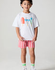 Full body front view of a boy wearing the Chaser Sunglass Pop Tee on a neutral background