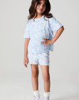 Full body front view of a girl wearing the Chaser Unicorn Lightning Tee on a neutral backgroundront