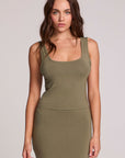Front view of a woman wearing the Chaser Verze Forager Green on a neutral background with arms down