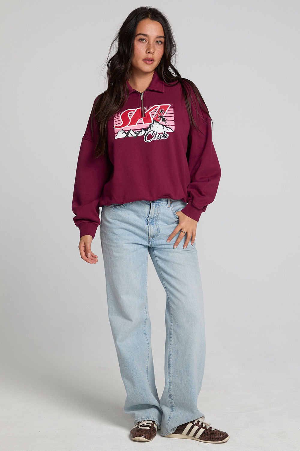 A full body front view of a woman wearing the Chaser 1986 Ski Club Long Sleeve on a neutral background