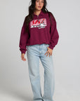A full body front view of a woman wearing the Chaser 1986 Ski Club Long Sleeve on a neutral background