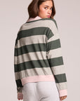 Back view of a woman wearing the Chaser Allstar 62  Long Sleeve on a neutral background