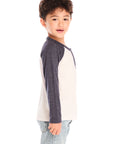 Side view of boy wearing Chaser’s Lightning Bolt henley long sleeve top with jeans on a white background