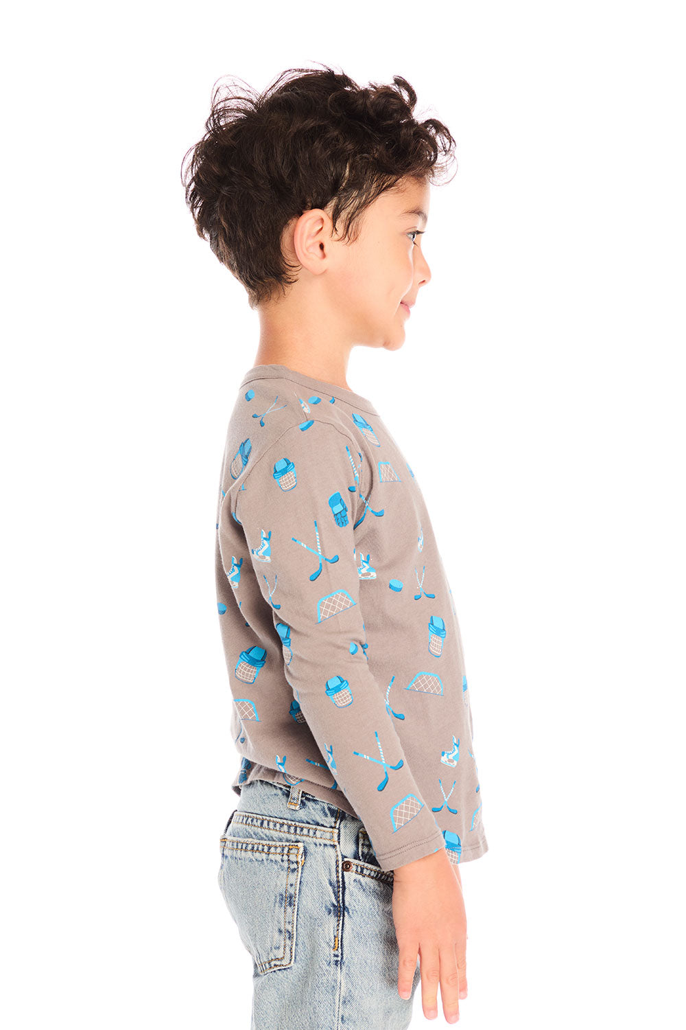 Side view of boy wearing Chaser’s Hockey Champ patterned long-sleeve top against a white background