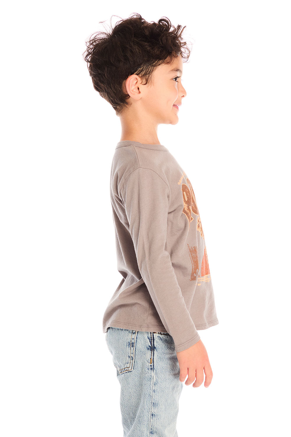 Side view of boy wearing Chaser’s Hold Your Horses dark grey long sleeve with cowboy horse graphic against a white background