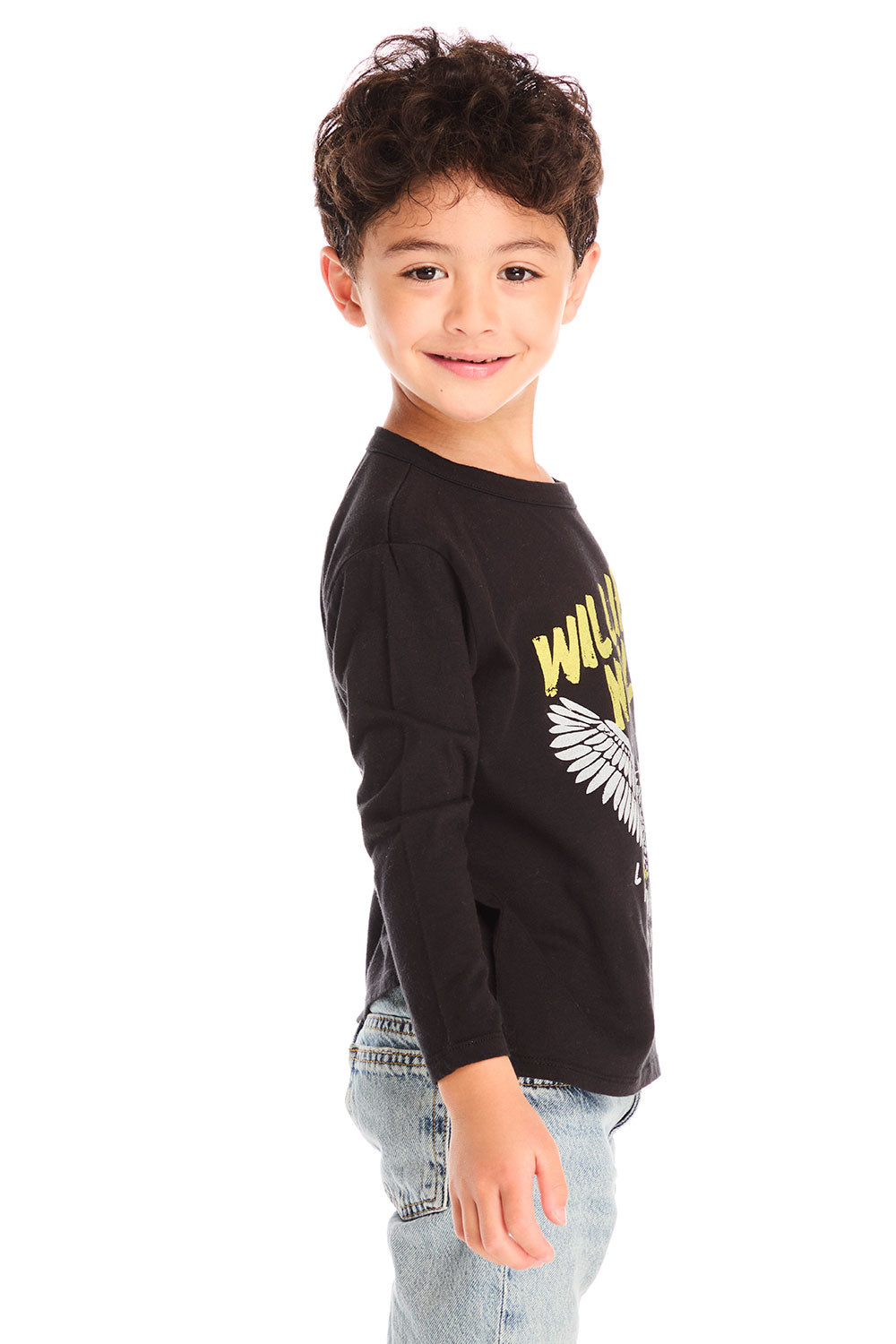 Side view of boy wearing Chaser’s Willie Nelson Willie 1978 black long sleeve with graphic detail on a white background