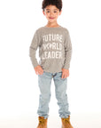 Full body view of boy wearing Chaser’s Future World Leader gray long sleeve top with jeans and boots on a white background