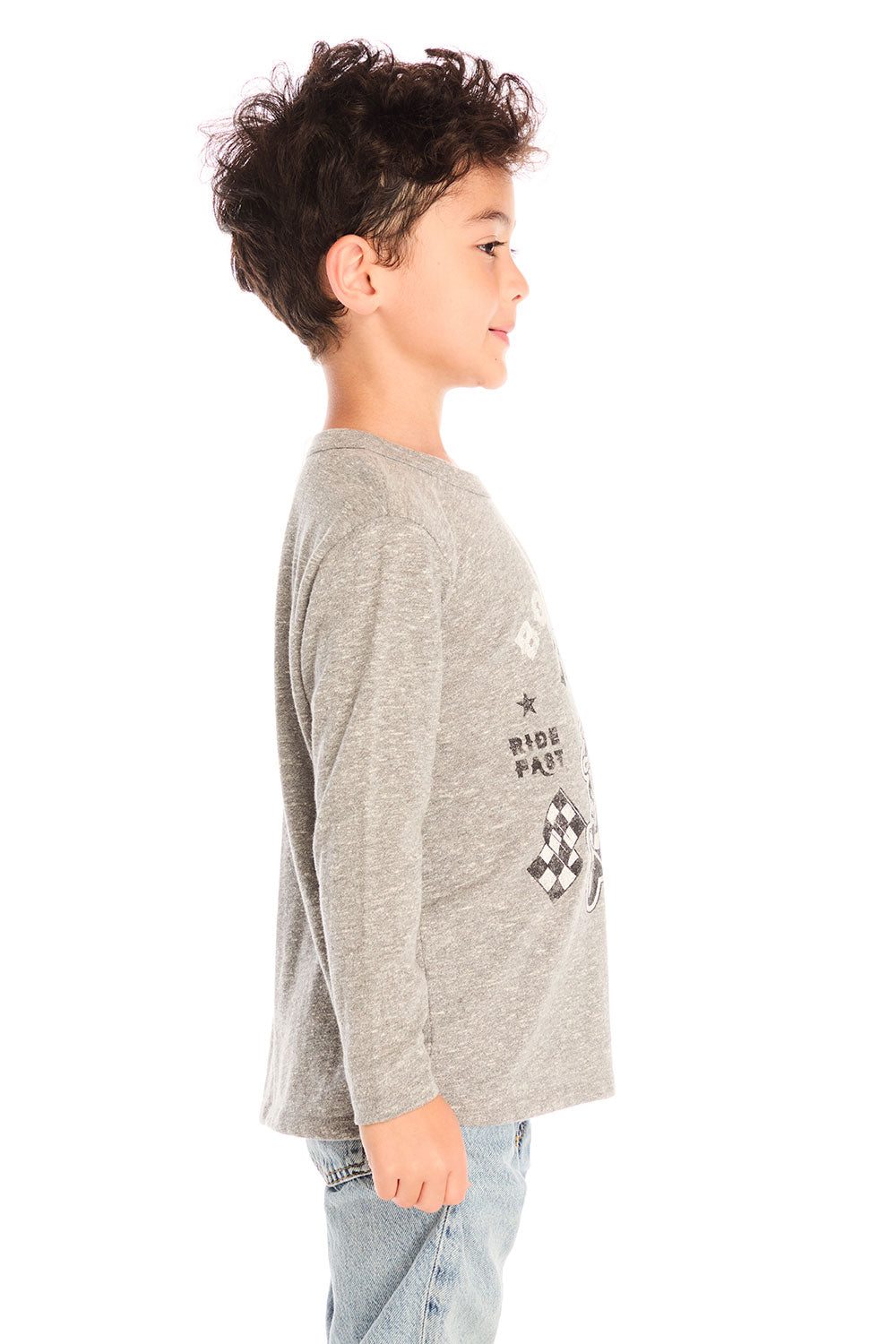 Side view of boy wearing Chaser’s Off To The Races grey long sleeve top with motorcycle and race flag graphic and “Born to Ride” text against a white background