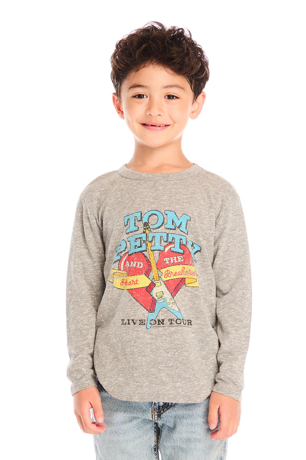 Boy wearing Chaser’s Tom Petty Live On Tour gray long-sleeve top with a broken heart and guitar graphic design and light blue jeans on a white background