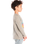 Side view of boy wearing Chaser’s Tom Petty Live On Tour gray long-sleeve top with graphic design and light blue jeans on a white background