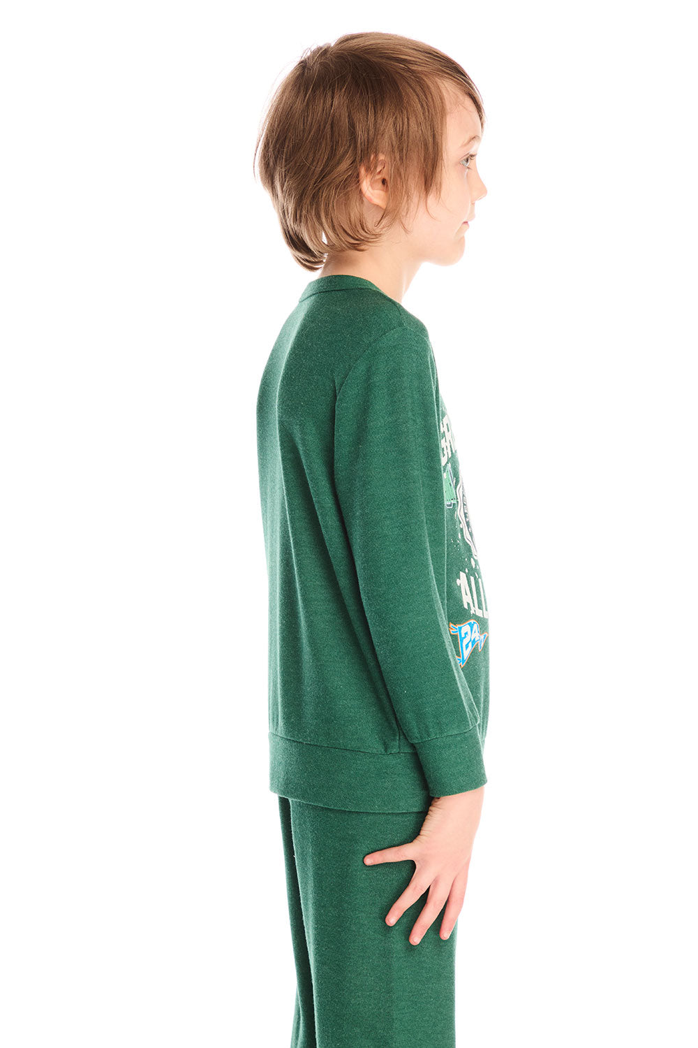 Side view of boy wearing Chaser’s Greatest Of All Time Everest Green long sleeve top with text graphic on a white background