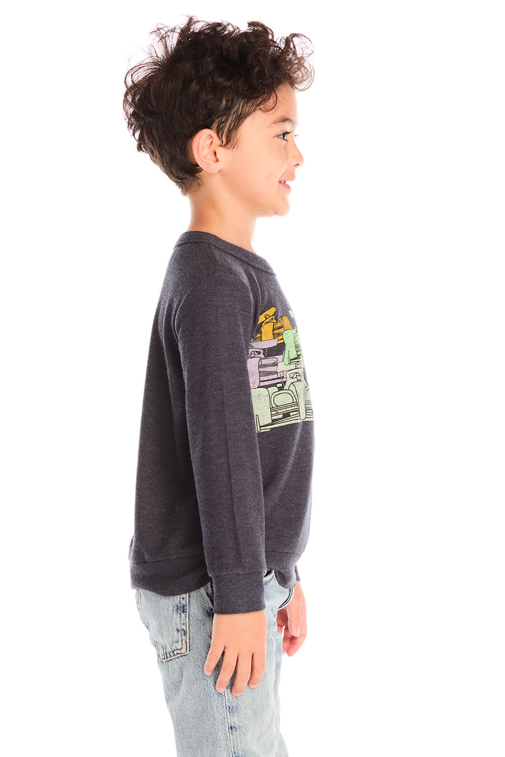 Side view of boy wearing Chaser's Allover Racing dark gray sweatshirt with colorful graphic design on a white background