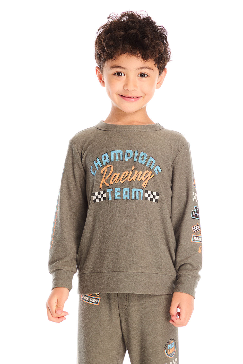 Boy wearing Chaser’s Safari Green Champions Racing Team long sleeve top with matching pants on a white background